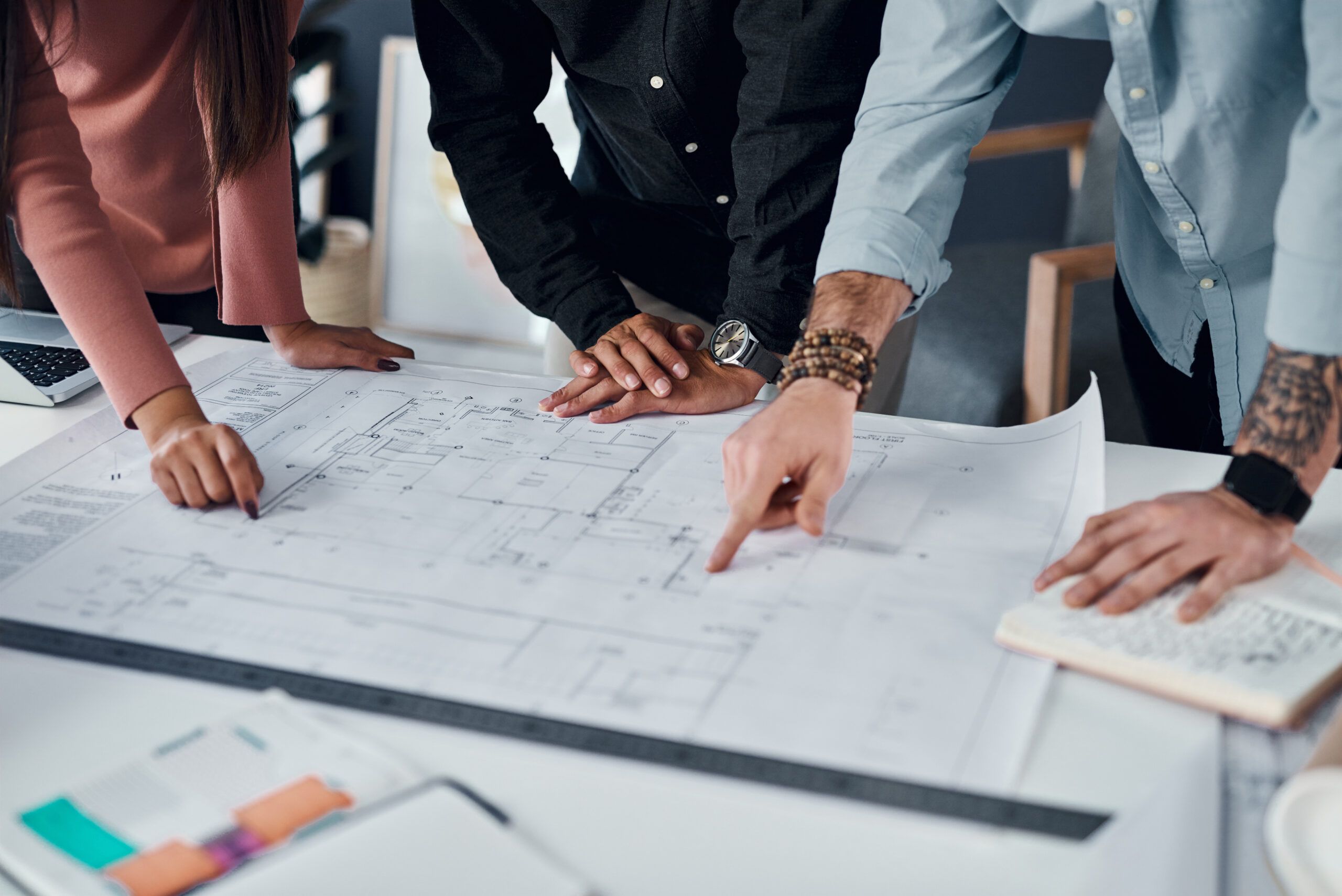 Team looking over architectural drawings