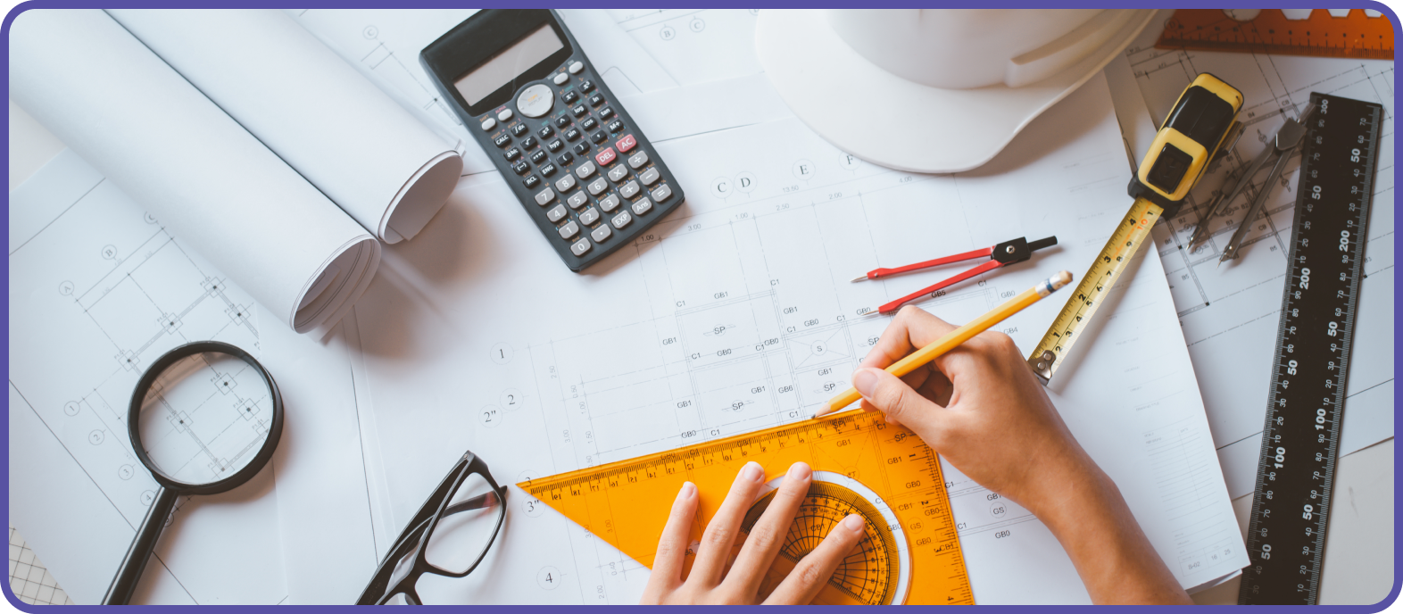 Man using right angles triangular ruler to measure architectural drawing